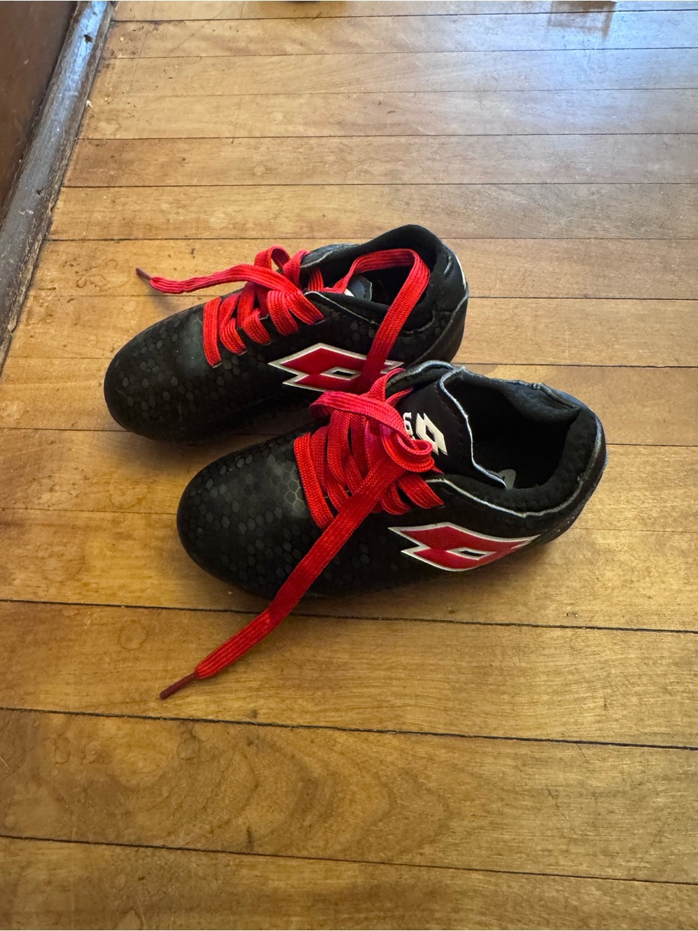 OTTO Kids Black Soccer Cleats with Red Accents